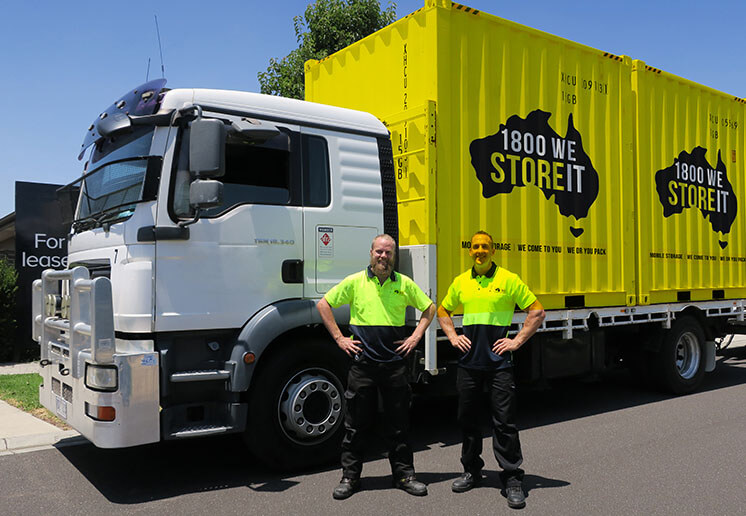 men with storage truck